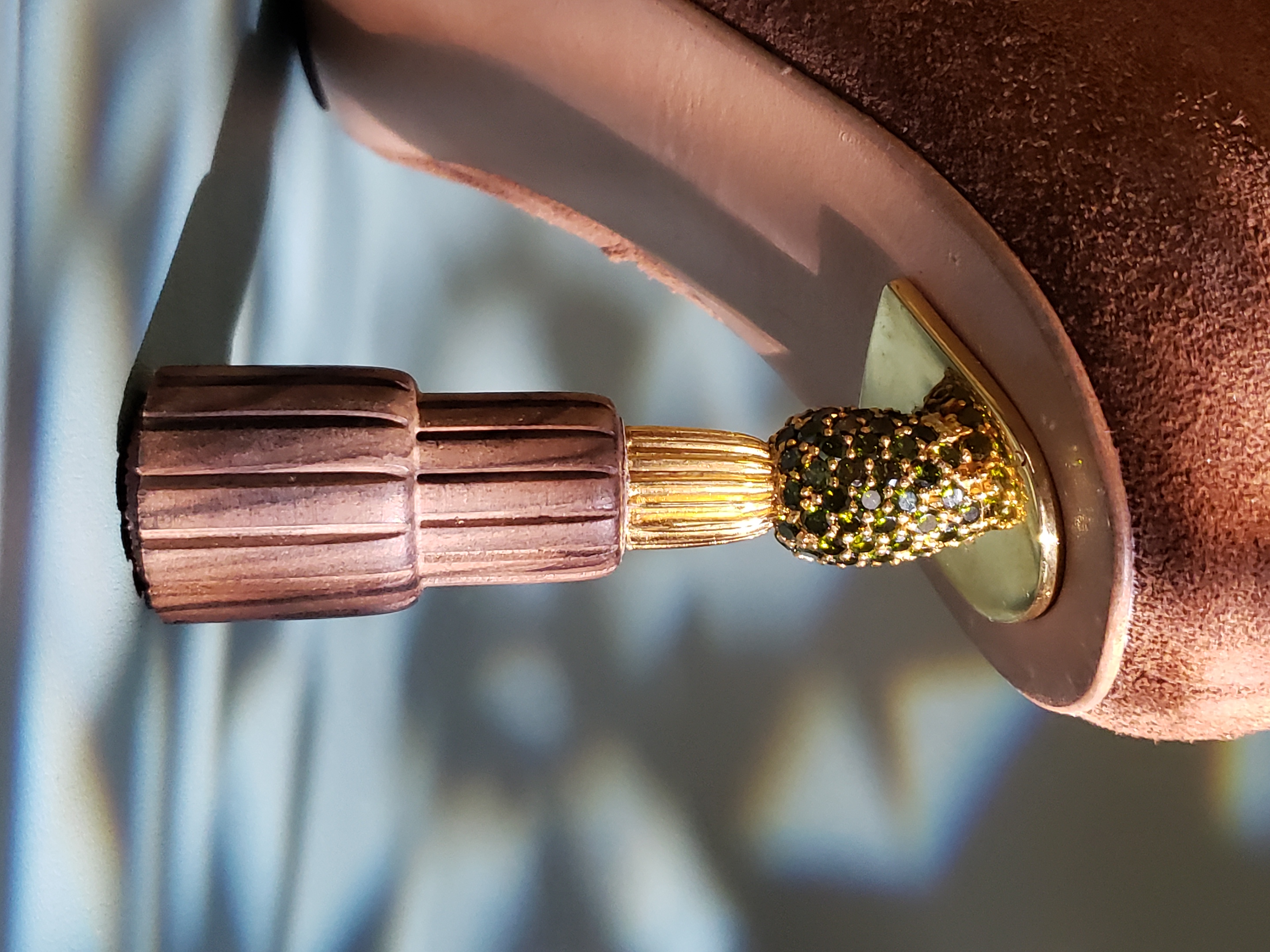 Blossfeldt heel detail — fluted wood and jeweled bud